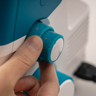 A person is using a PFAFF Admire Air 5000 sewing machine.