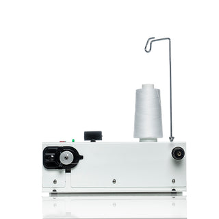 A white PFAFF Powerquilter 1600 Stationary Quilter with Table.