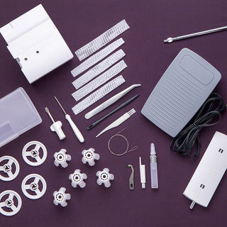 A Pfaff Admire Air 7000 sewing tools set on a purple background.