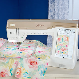 A Baby Lock Altair Sewing & Embroidery Machine with a floral pattern on it.