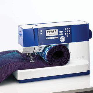 A blue and purple PFAFF Ambition 610 Sewing and Quilting Machine on a table.