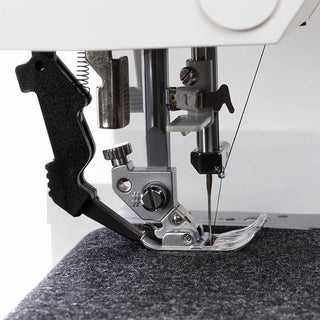 A Pfaff Ambition 610 Sewing and Quilting Machine with a needle attached to it.