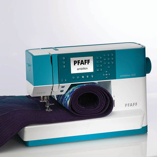 A PFAFF Ambition 620 Sewing and Quilting Machine with a blue and purple fabric.