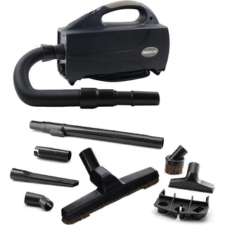 The Oreck Compact Canister BB1200DB in black is a versatile portable handheld vacuum cleaner that includes a flexible hose attachment and multiple accessory nozzles, brushes, and extensions. It features HEPA filtration for effective cleaning across various surfaces.