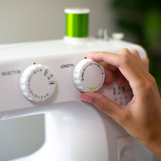 A person is using a Baby Lock Zest sewing machine.