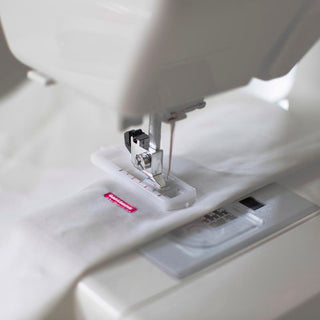 A close up of a Baby Lock Joy sewing machine with the Baby Lock label on it.