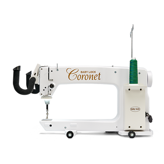 A white Baby Lock sewing machine with the word Coronet on it.