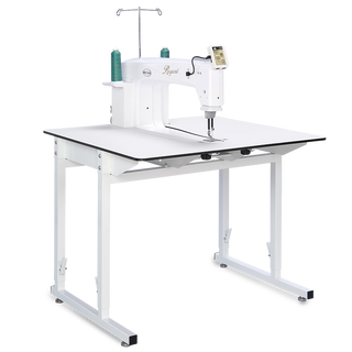 A Baby Lock Regent Longarm 18" Quilting Machine on a white table.