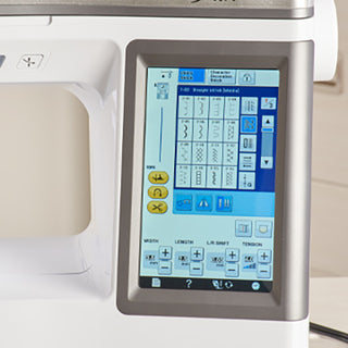A Baby Lock Ballad Sewing and Quilting Machine with a touch screen on it.