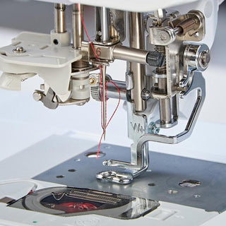 The Baby Lock Pathfinder Embroidery Machine by Baby Lock is equipped with IQ Technology, offering precision and efficiency. This innovative sewing machine features a needle attached to it, allowing for professional-quality stitching.