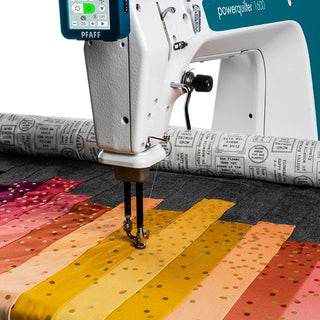 A Pfaff Powerquilter 1600 Stationary Quilter with Table is being used to make a quilt.