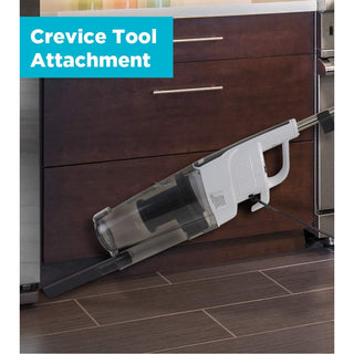 A Simplicity S60 Spiffy Broom Vacuum attached to the floor of a kitchen.