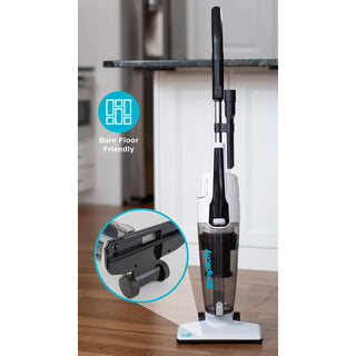 A Simplicity S60 Spiffy Broom Vacuum on a wooden floor.