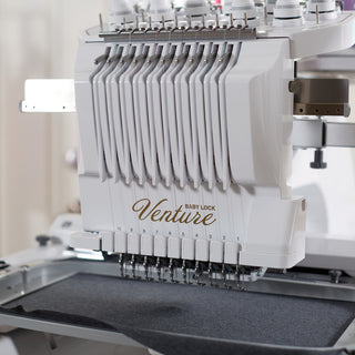 A Baby Lock Venture with Table embroidery machine with the word valuzite on it.