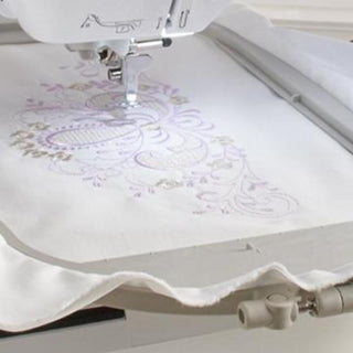 A Baby Lock Vesta Sewing & Embroidery Machine is being used to embroider a piece of fabric.