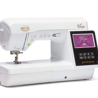 A Baby Lock Vesta Sewing & Embroidery Machine with a pink screen.