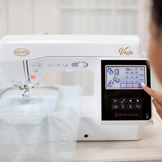 A woman is using a Baby Lock Vesta Sewing & Embroidery Machine to make a design.