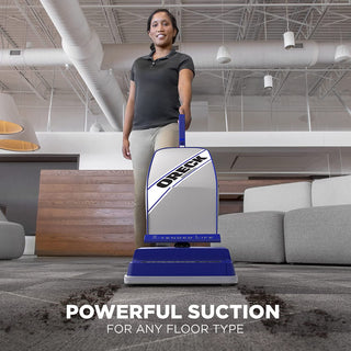 A woman standing in front of an Oreck Commercial XL2100RHS Commercial Upright Vacuum Cleaner XL with the words powerful suction.