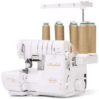 A Baby Lock Accolade Serger with four spools of thread.