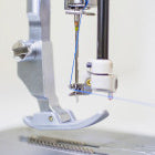A Baby Lock Accomplish Quilting and Sewing Machine on a white background.