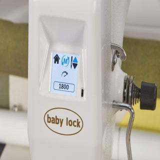A Baby Lock Gallant sewing machine with a button on it.