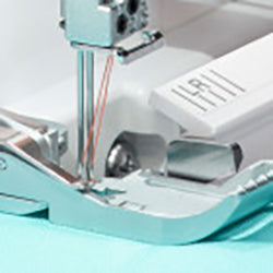 A Baby Lock Accolade Serger sewing machine with a needle attached to it.