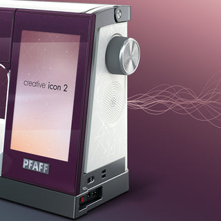 A PFAFF Creative Icon 2 - Purple Aurora machine with a screen on it.