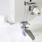 A Baby Lock Accomplish Quilting and Sewing Machine is being used to sew a shirt.