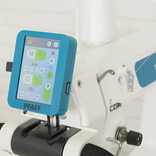 A PFAFF Powerquilter 1650 Stand Up Quilter with 5' Frame sewing machine with an ipad attached to it.