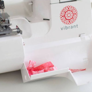 A Baby Lock Vibrant 4/3/2 Thread Serger with a pink ribbon attached to it.