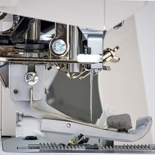 A close up of a Baby Lock Victory Serger sewing machine.